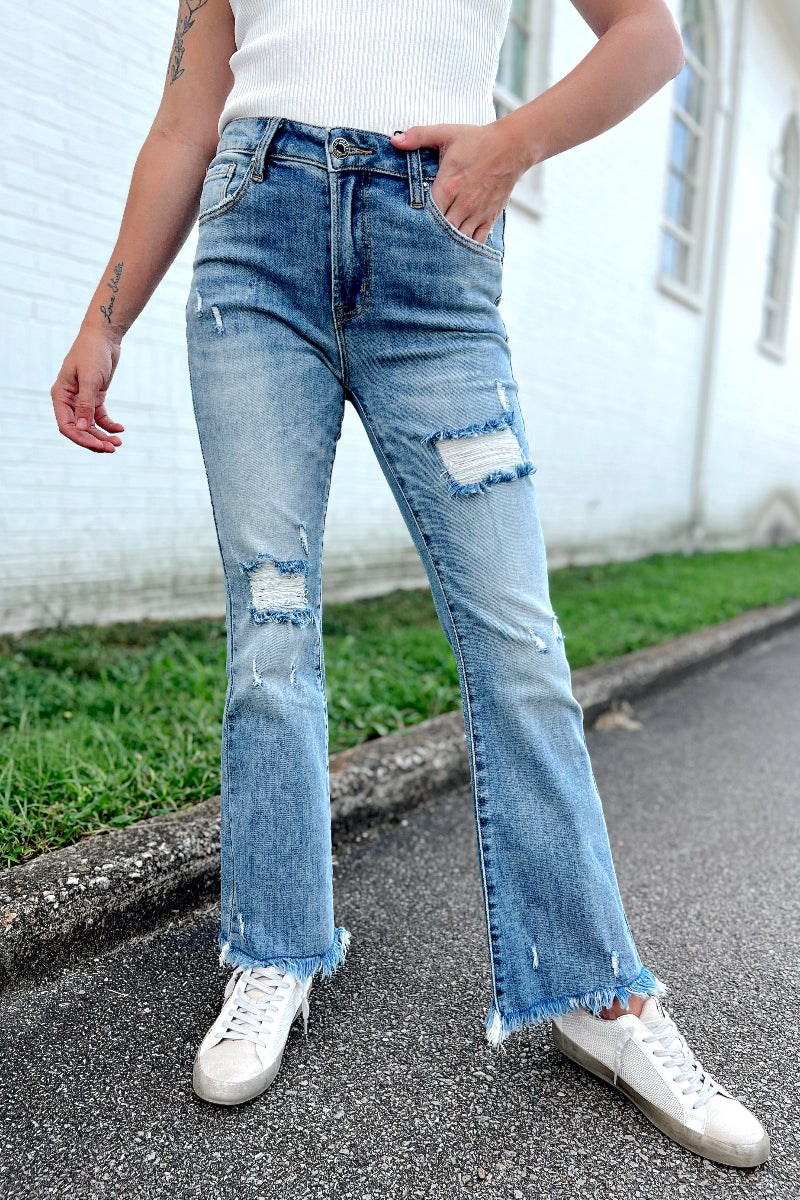 Risen Light Mid Rise Distressed Ankle Flare Jeans